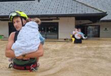 Firefighters rescue kids from a flooded kindergarten.